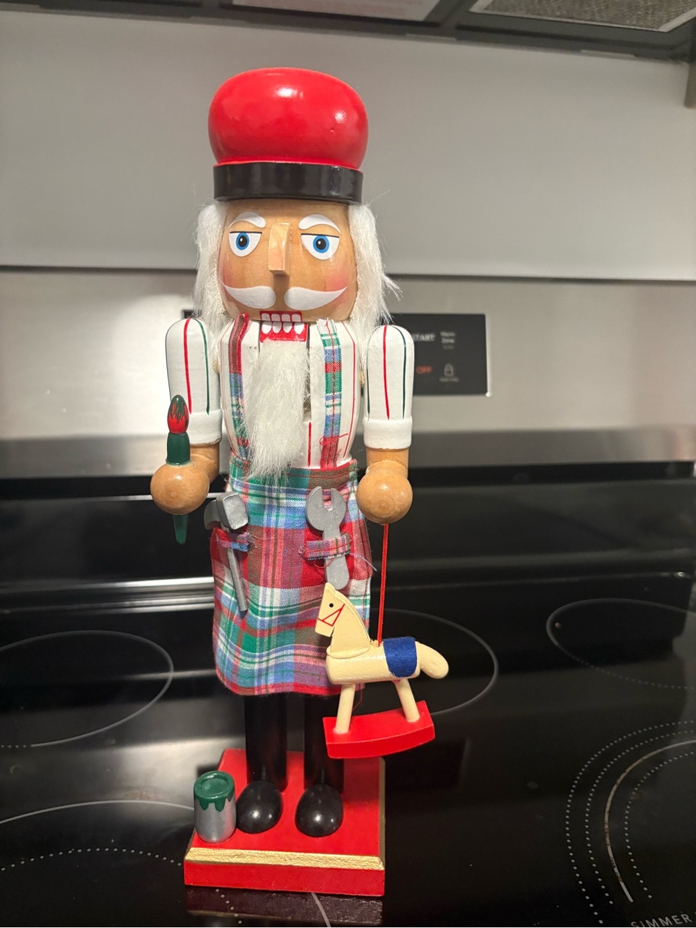 Wooden Nutcracker with Red Hat and Plaid Kilt